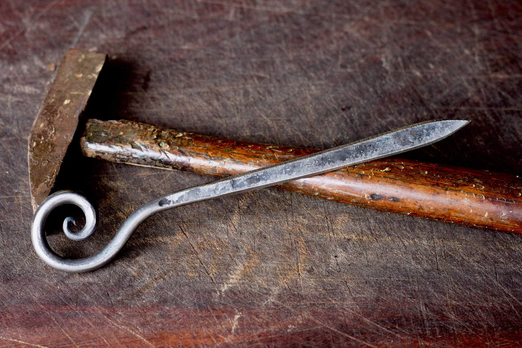 a blacksmith hand forged letter opener with a spiral scroll handle by Wicks Forge