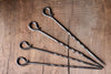 A set of hand forged iron Skewers with desired scroll handle by Wicks Forge