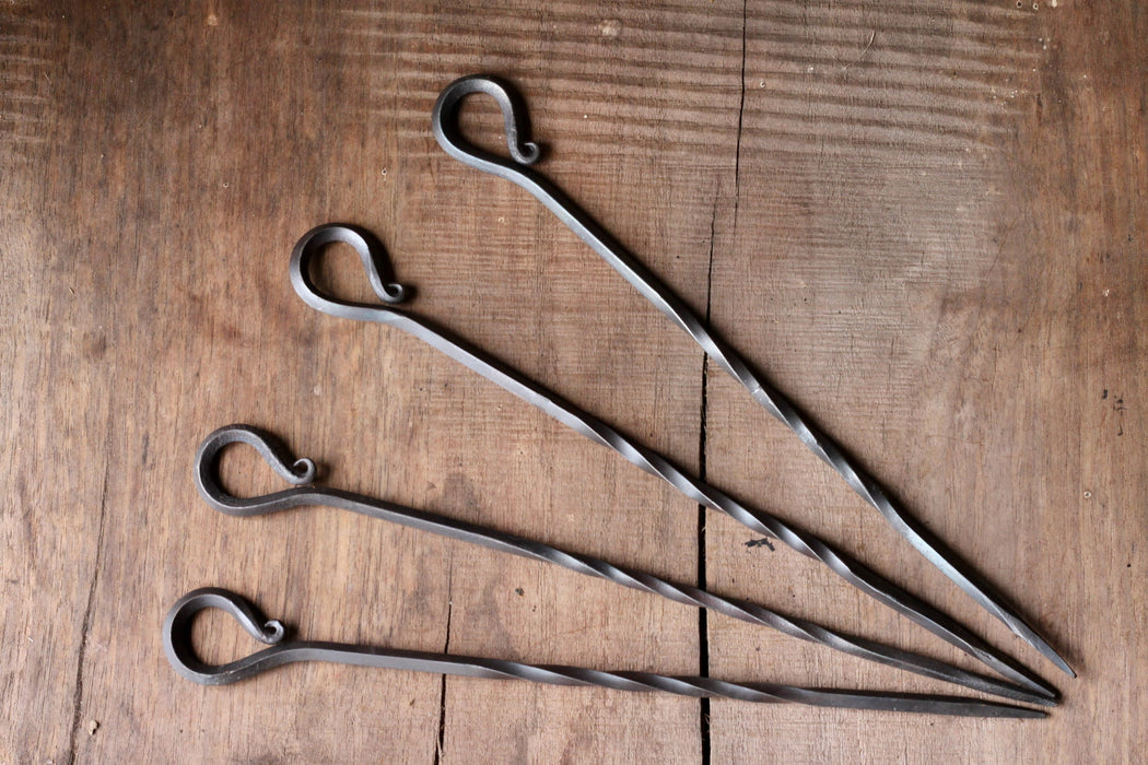 A set of hand forged iron Skewers with desired scroll handle by Wicks Forge