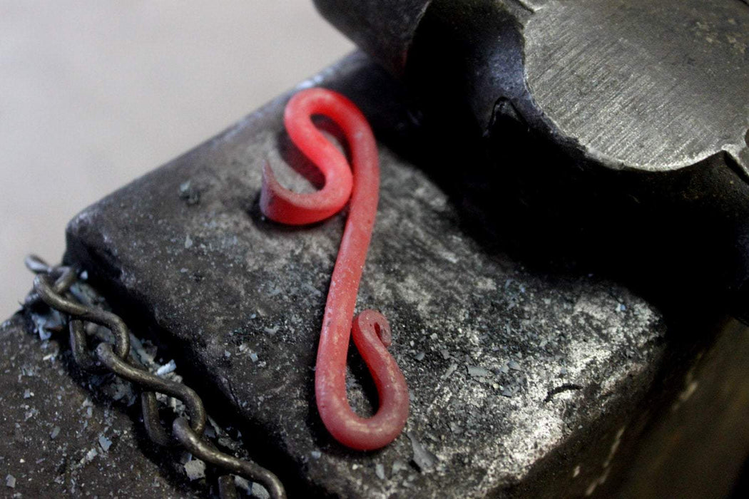 a blacksmith hand forged small keychain bottle opener by Wicks Forge