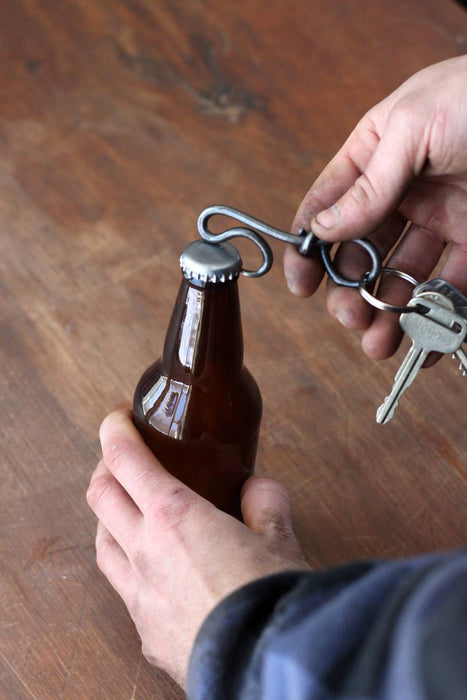 a blacksmith hand forged keychain bottle opener by Wicks Forge