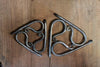 a 4 inch and 7 inch blacksmith hand forged trivet pot holder by Wicks Forge
